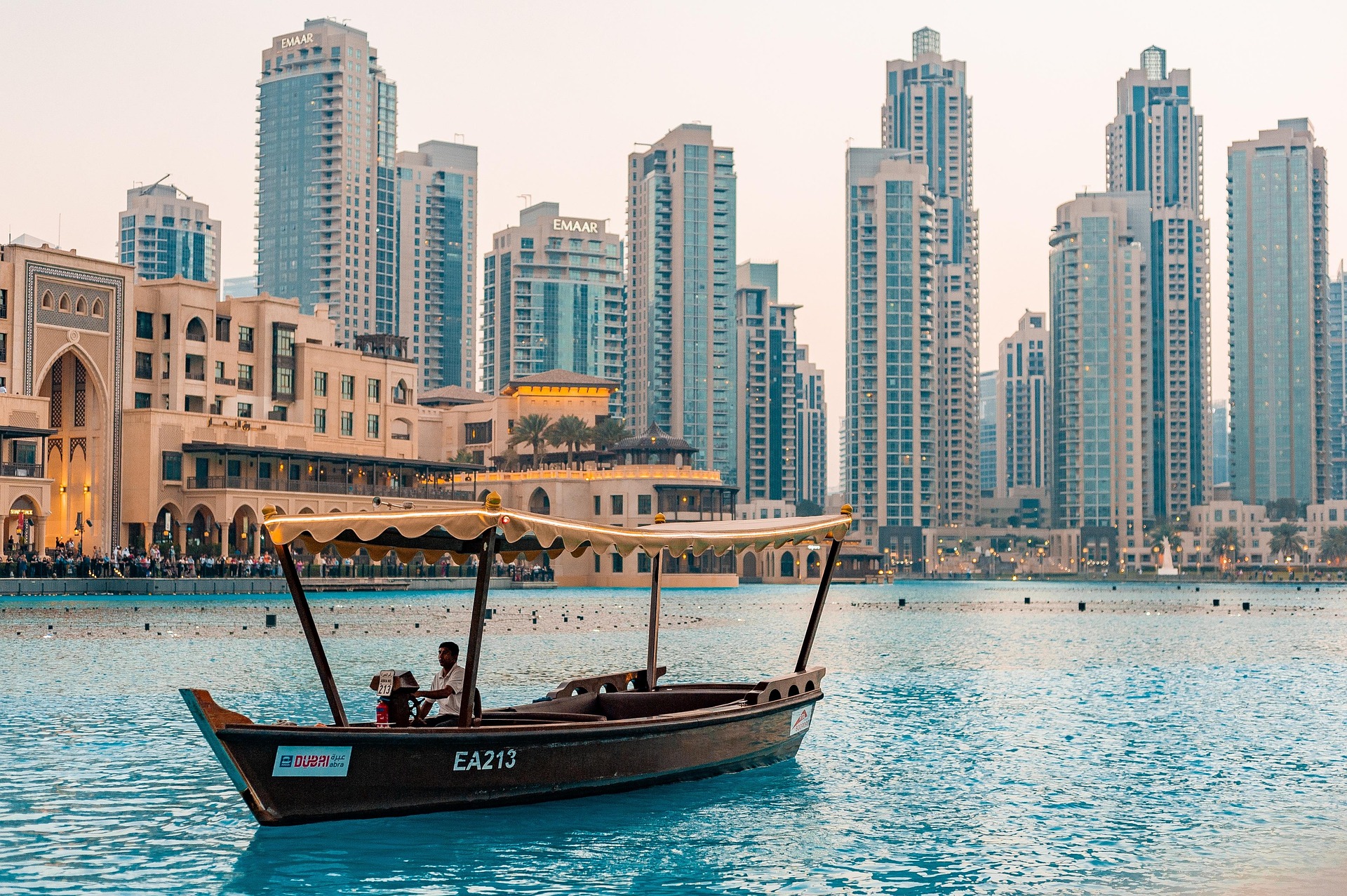 Dubai waterfront skyline with traditional boat